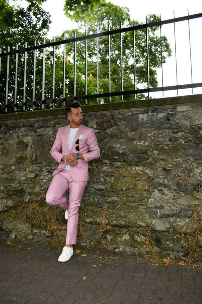 Pink Suit and white trainers